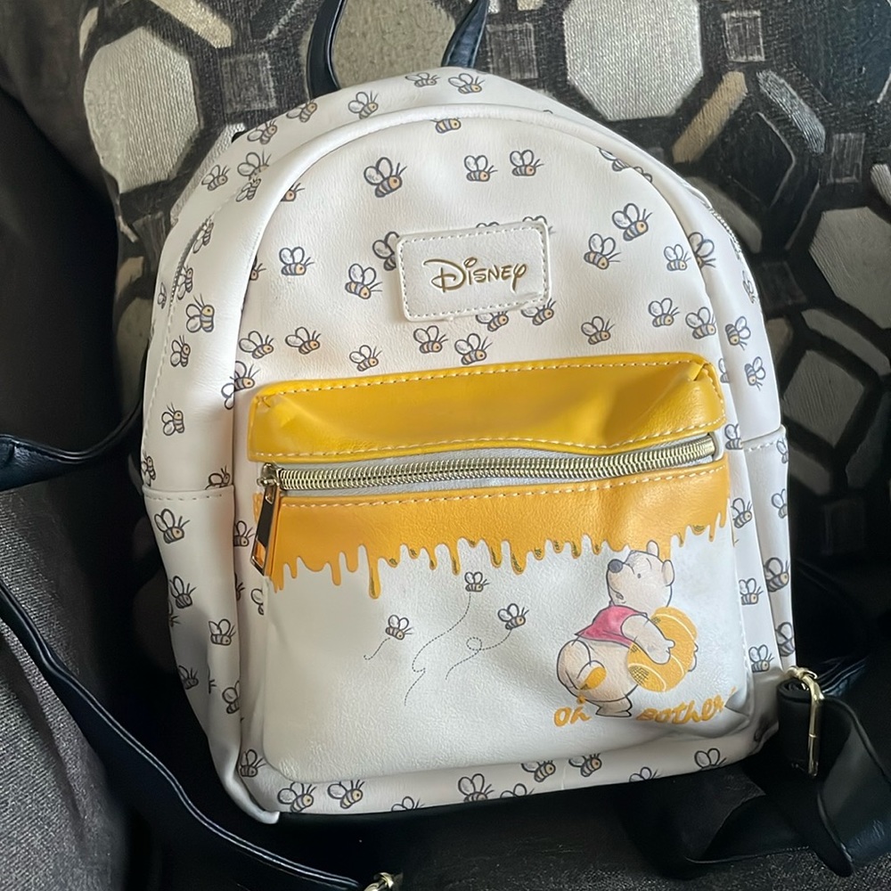 Disney backpack Winnie the Pooh…. I am willing to take offers!